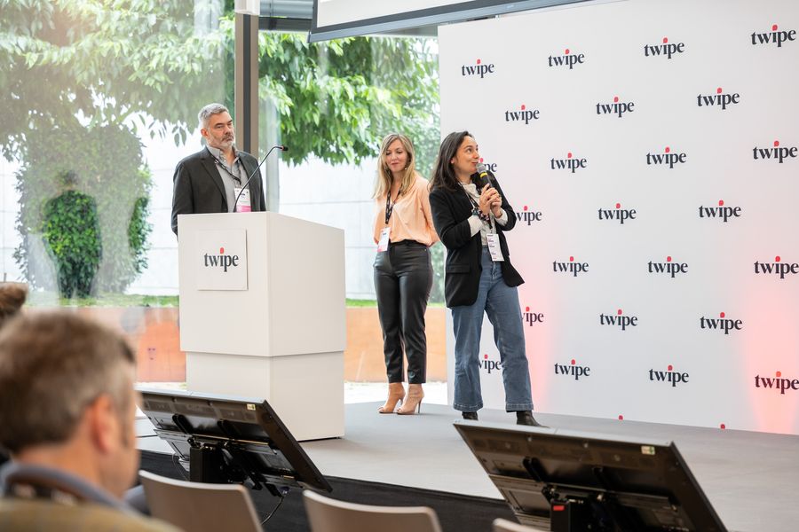 Speakers on stage with a microphone